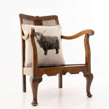 Load image into Gallery viewer, Billy Coo Pedigree Cushion in Natural sitting on an antique chair