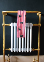 Load image into Gallery viewer, Pink Billy Coo tea towel on radiator